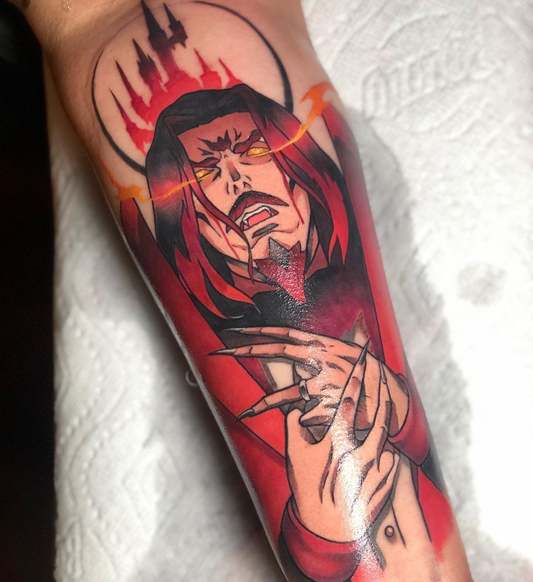 Red Dracula tattoo.