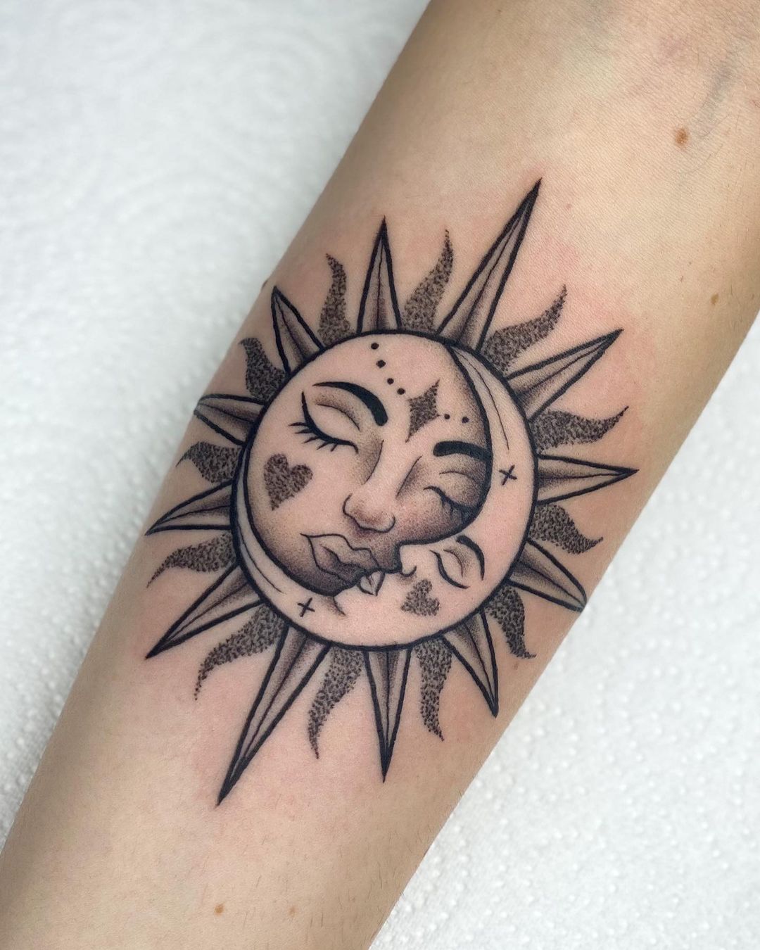 Sun and moon tattoos with faces. (Source: @ lucie.tattoo)