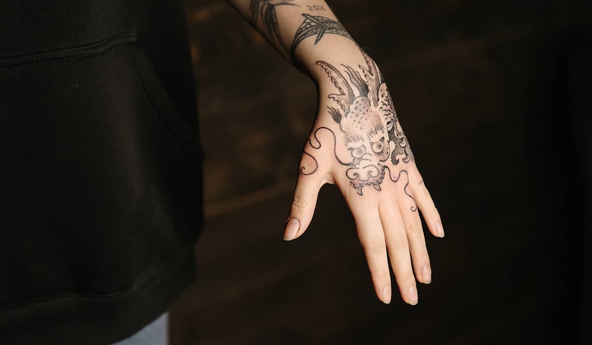 Black and white traditional hand tattoo.