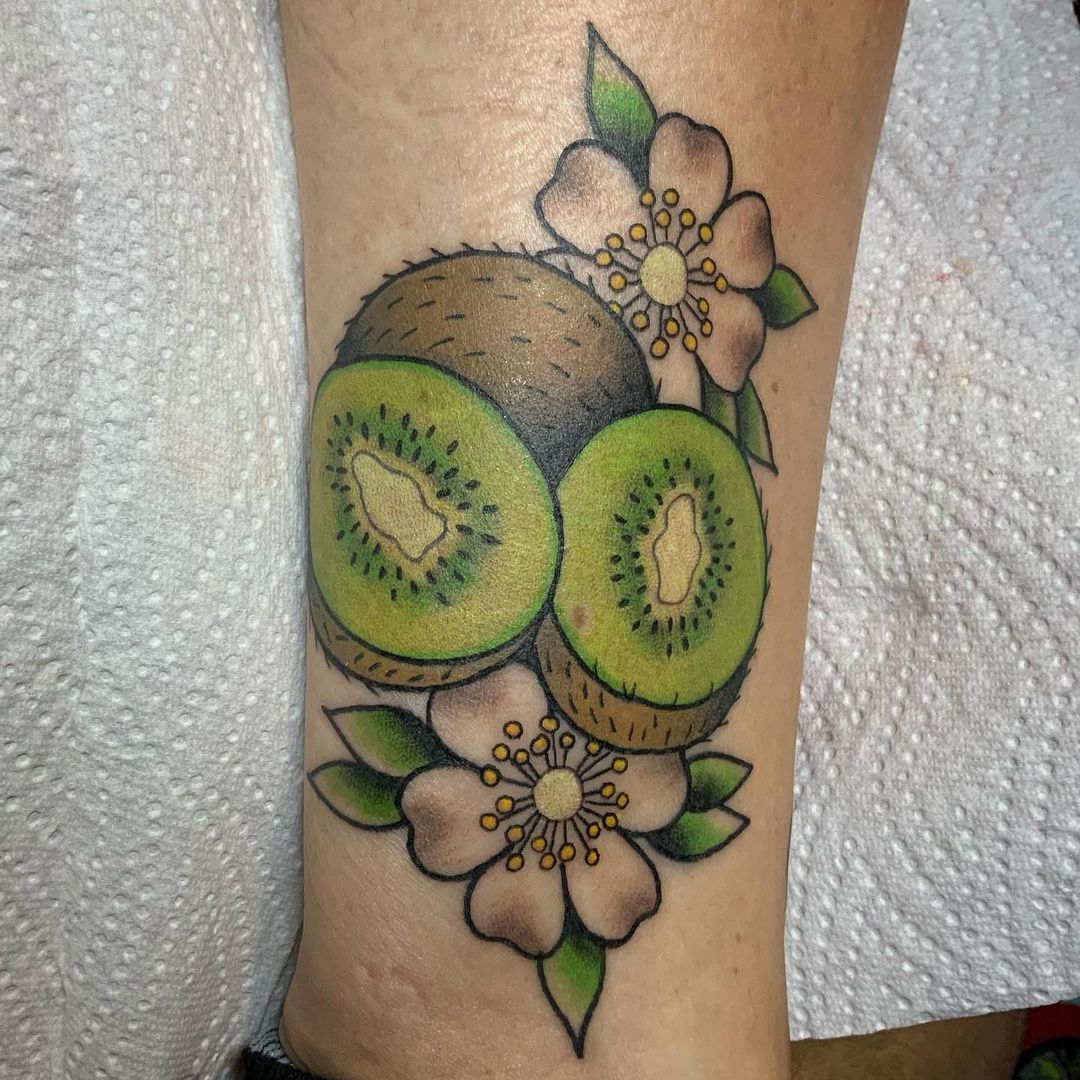 Floral kiwi fruit tattoo by @shan_mac.