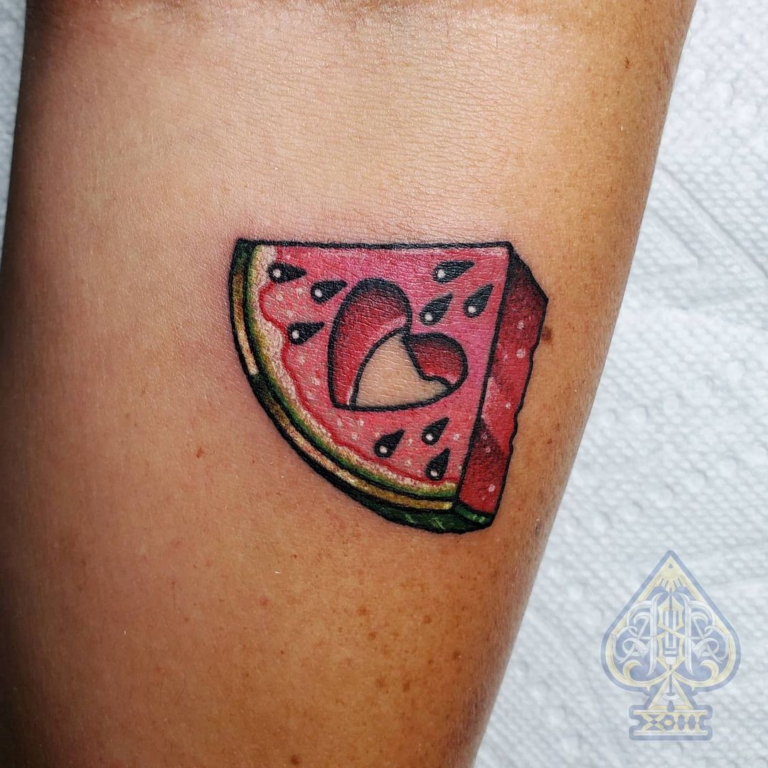 Heart shaped hole watermelon tattoo by @tatt_by_ajay