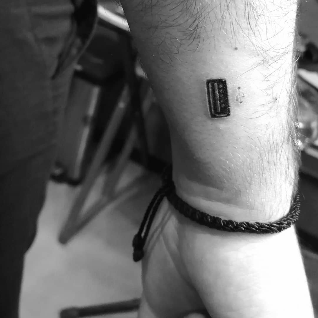 USB port tattoo.