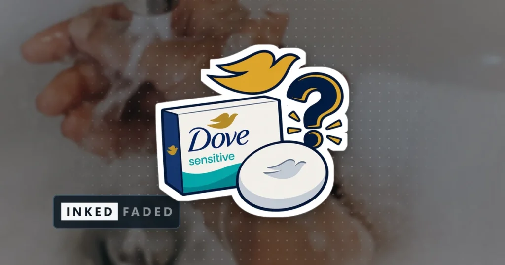 An illustrated carton and bar of Dove Sensitive soap with a gold dove mark and a question mark beside them, on a darkened photo of soapy hands being washed under a bathroom tap