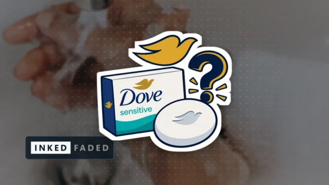 An illustrated carton and bar of Dove Sensitive soap with a gold dove mark and a question mark beside them, on a darkened photo of soapy hands being washed under a bathroom tap