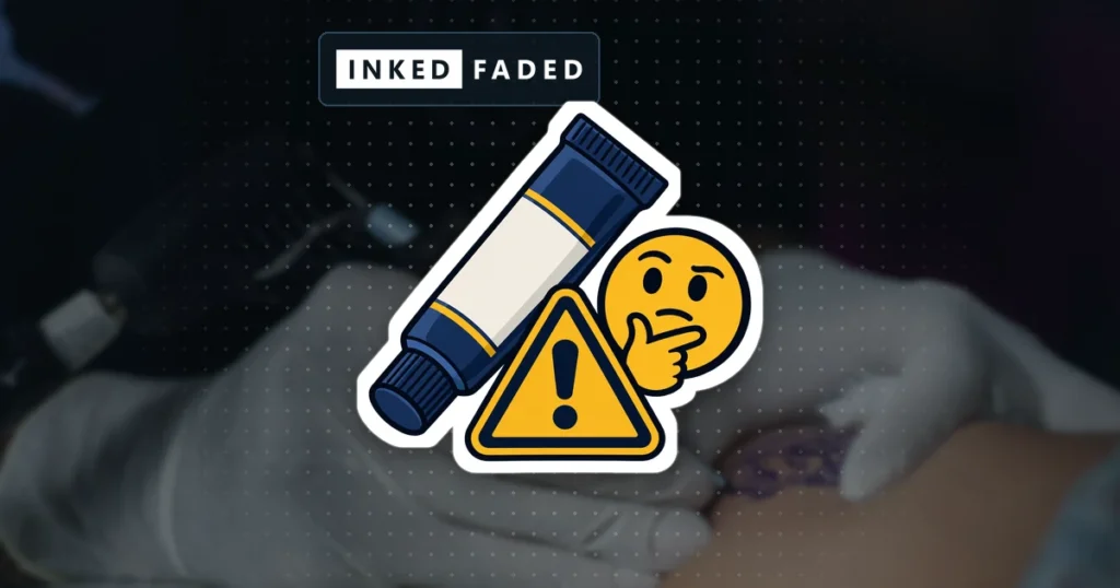 An illustrated unbranded ointment tube with a warning triangle and a thinking face, on a darkened photo of gloved hands tattooing